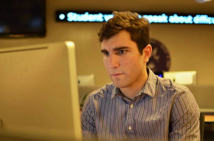 Jordan Rubio writes a story at TCU. Photo by:  Michael Macias-Martinez