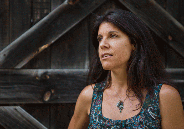 Yolie Moreno, in front of her barn on June 28, 2014, talks about sorting through several hundred thousand pieces of mail from around the world sent to Newtown after the Sandy Hook Elementary shooting. Moreno took photos of many of the notes, drawings, gifts and other letters and compiled them on embracingnewtown.com. Morgan Spiehs