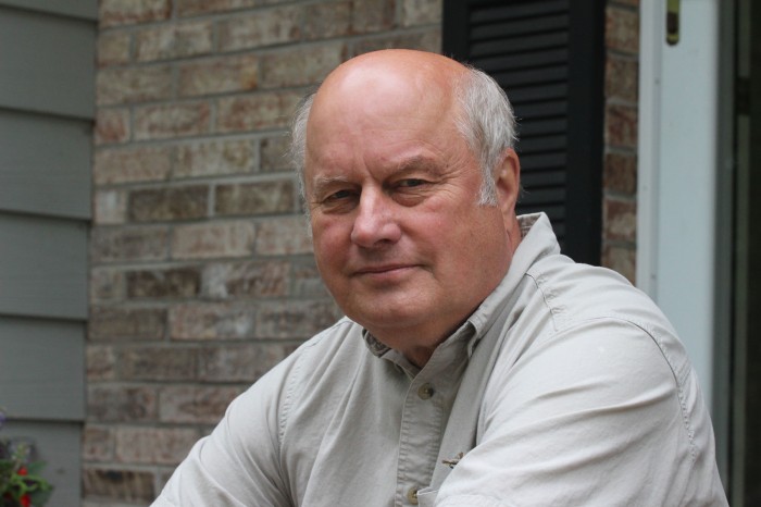 Mike Harden sits on his front porch steps at his house in Eau Claire, Wis. Harden will partake in his 56th deer hunt this Fall. Jessica Boehm