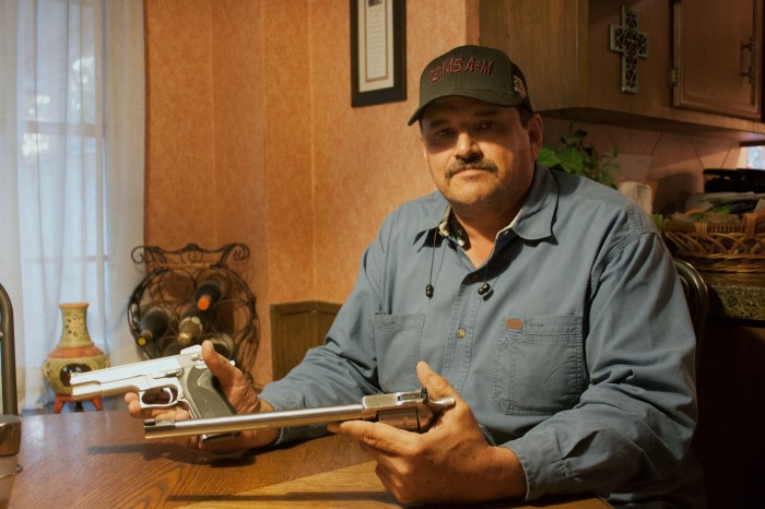 Peter Garza, a hunter from Missouri City, TX, holds two of the many guns that he owns. Garza has been hunting since he was 9 years old. Sydney Stavinoha